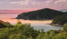 Beach in Nicaragua at sunset, with cliffs – Best Places In The World To Retire – International Living